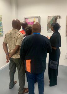 Visitors viewing Nasaria Suckoo Chollette’s Alchemy series at the exhibition’s opening reception